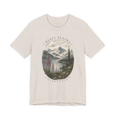 Soft nature t-shirt printed with an oval Alaska scene of snowy peaks, a still lake and fireweed by Evernorth — close-up