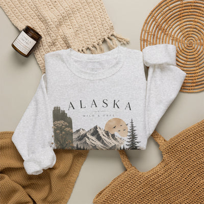 Soft crewneck sweatshirt with a muted Alaska mountain, lake, evergreen and moose illustration by Evernorth — view 14