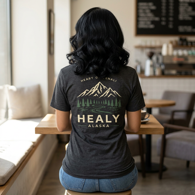 Soft jersey t-shirt with a detailed Healy Alaska mountain and spruce illustration in earthy tones by Evernorth — design detail