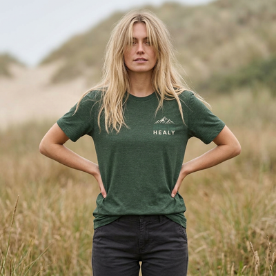 Soft jersey t-shirt with a detailed Healy Alaska mountain and spruce illustration in earthy tones by Evernorth — back view