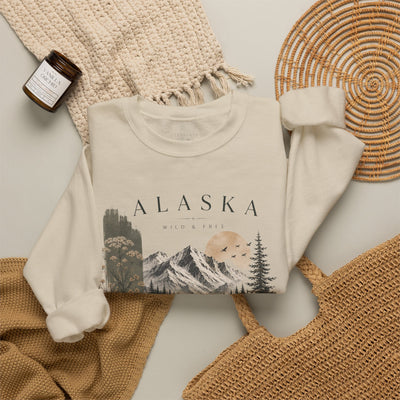 Soft crewneck sweatshirt with a muted Alaska mountain, lake, evergreen and moose illustration by Evernorth — view 17