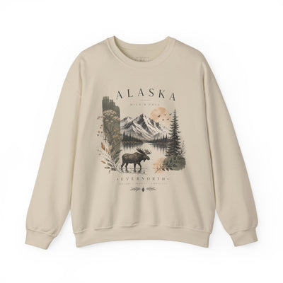 Soft crewneck sweatshirt with a muted Alaska mountain, lake, evergreen and moose illustration by Evernorth — close-up