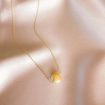 Quiet Light Disc Necklace, product photo, elevated everyday minimal jewelry by Evernorth Design