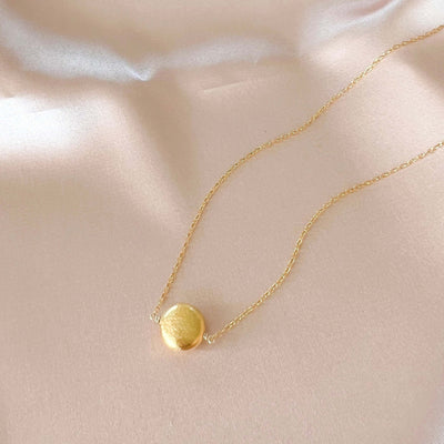 Quiet Light Disc Necklace, product photo, elevated everyday minimal jewelry by Evernorth Design