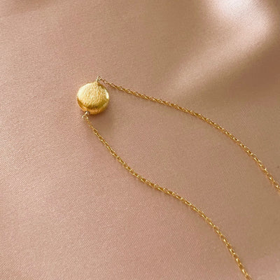 Quiet Light Disc Necklace, product photo, elevated everyday minimal jewelry by Evernorth Design